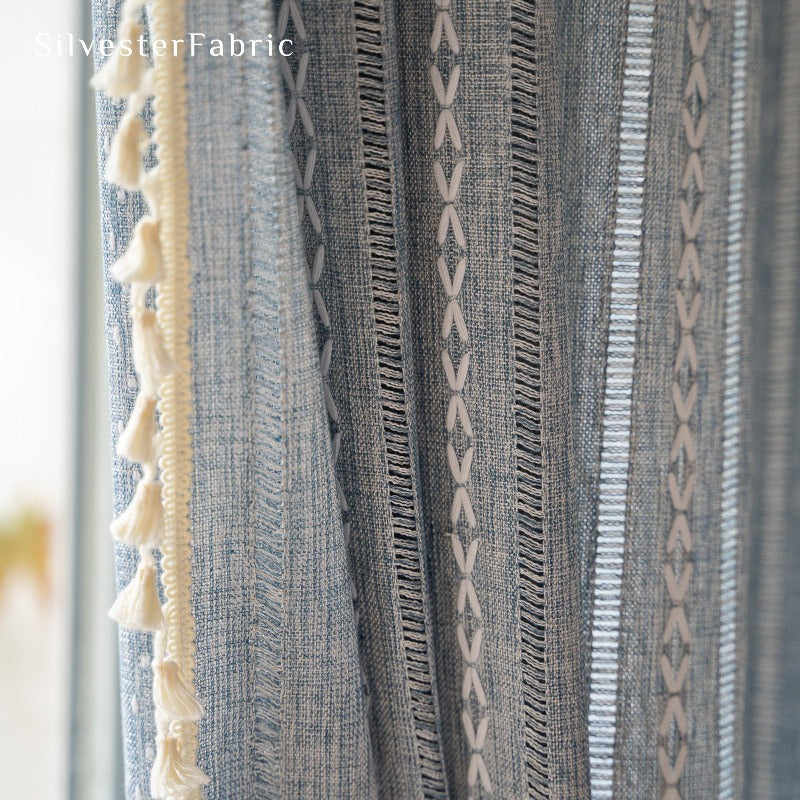 Light blue curtains hanging in the bedroom window