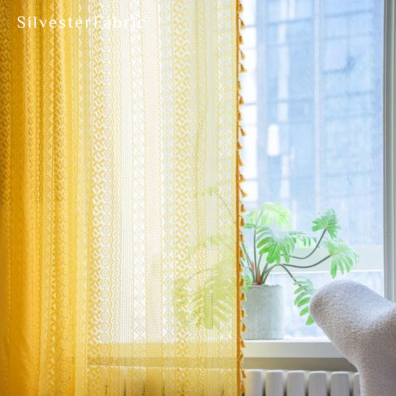 yellow sheer lace curtain drape and fold detail