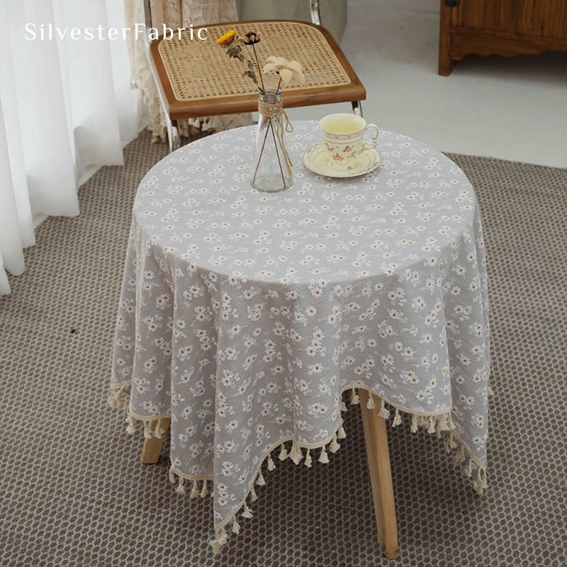 Floral beige tablecloth covers the table