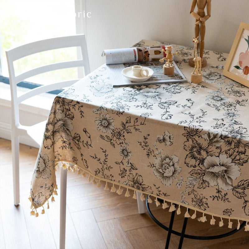 Close‑up of rectangle vintage floral beige tablecloth corner