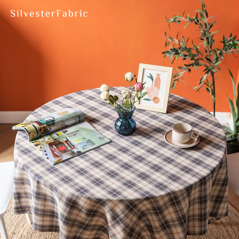 beige Christmas tartan plaid cotton tablecloth draped over round table