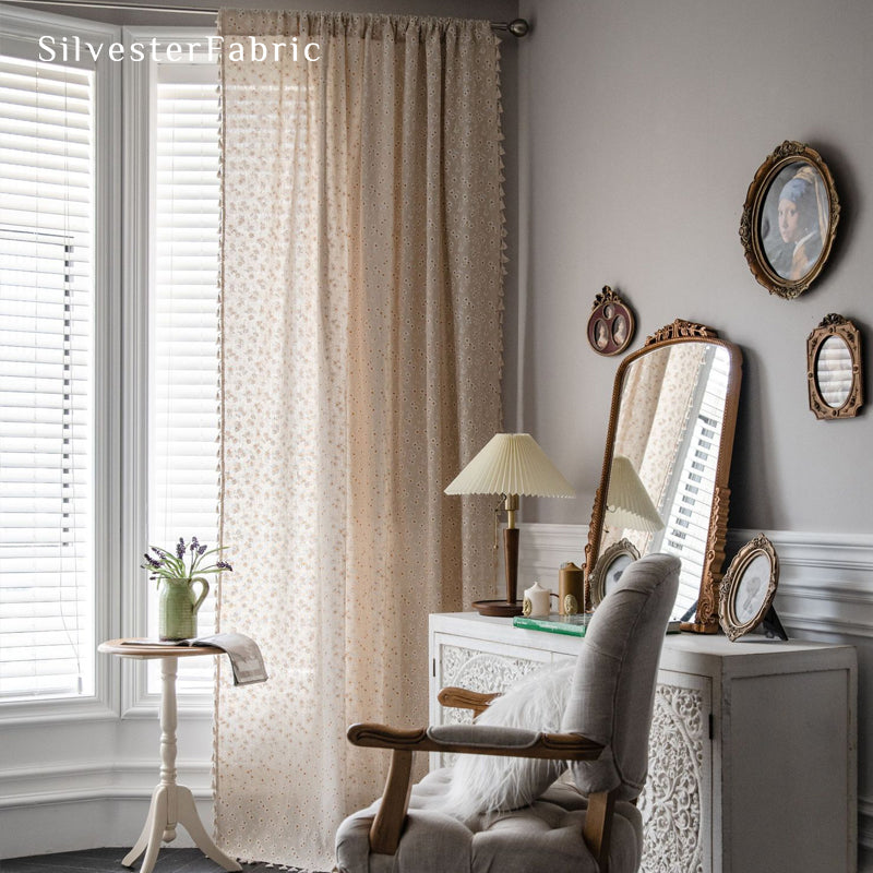 beige farmhouse floral curtain hanging in window