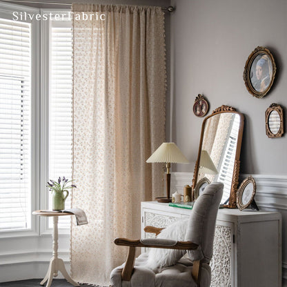 beige farmhouse floral curtain hanging in window