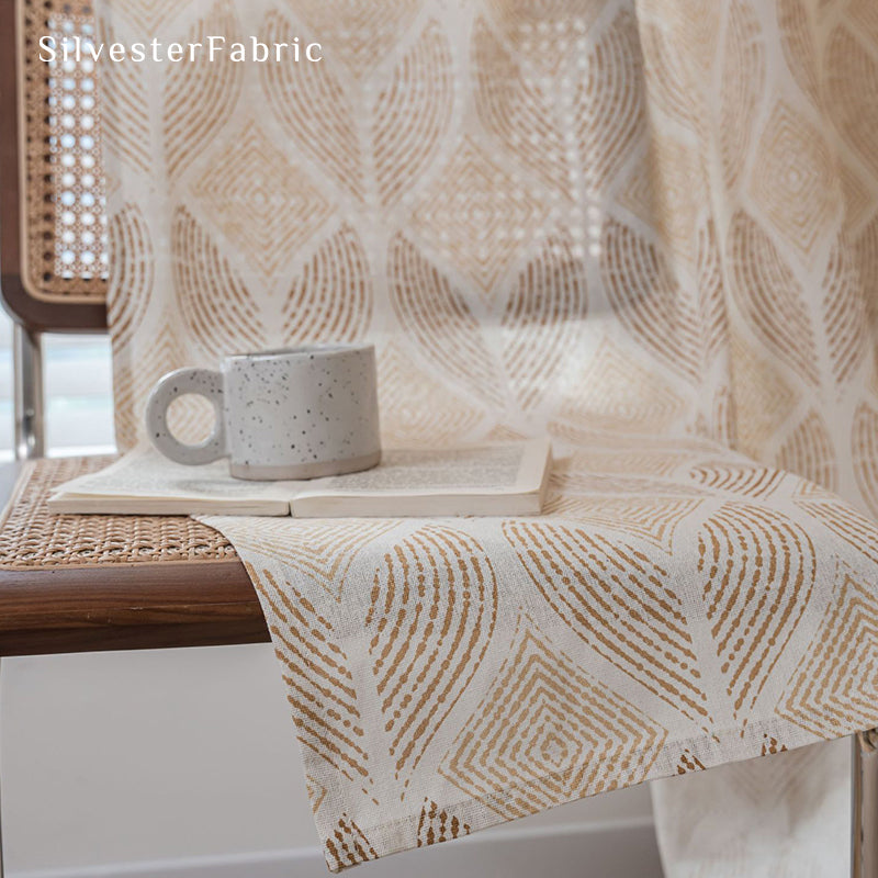 Beige printed linen curtains hang in the bedroom window.