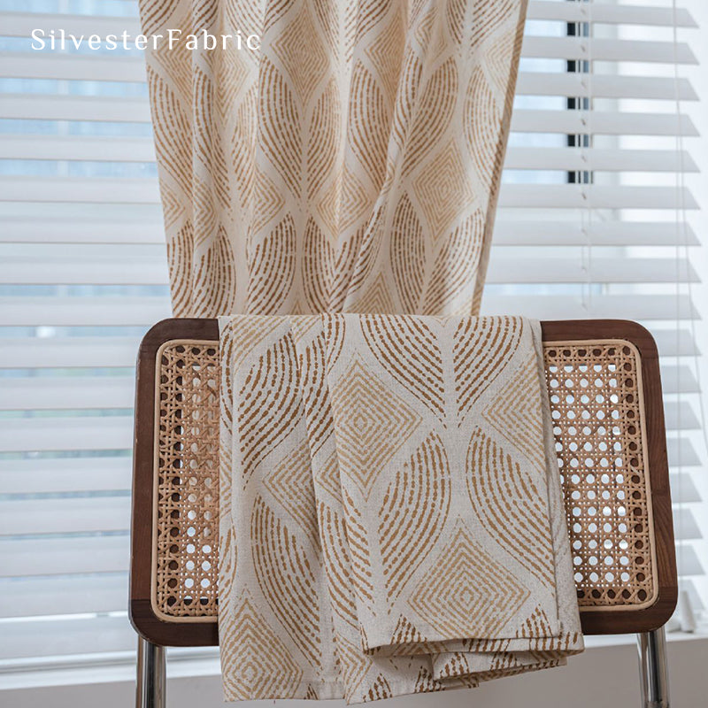 Beige printed linen curtains hang in the bedroom window.