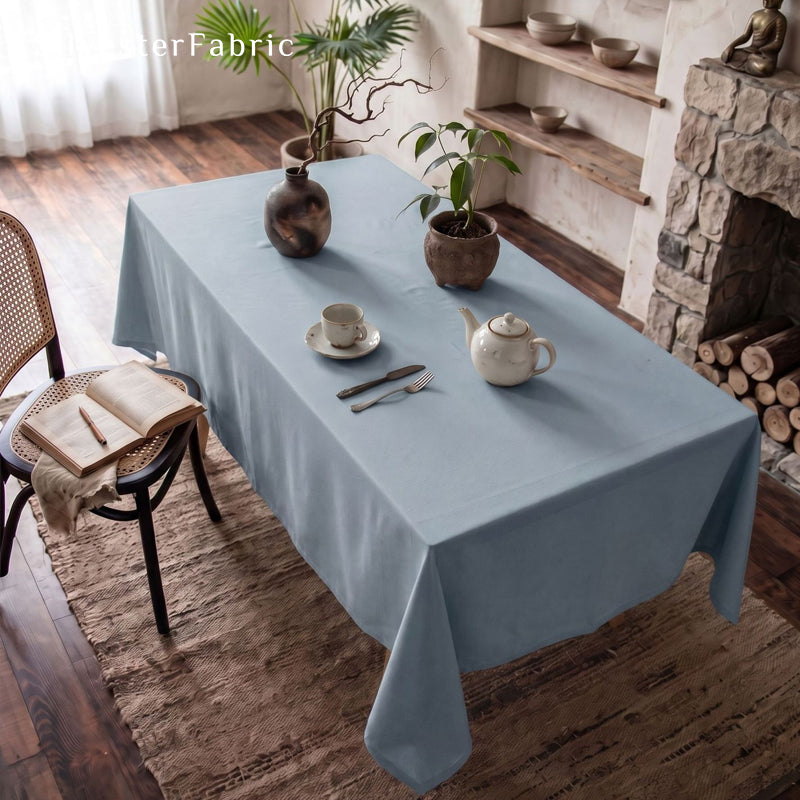 solid blue rectangle tablecloth draped over rectangle table
