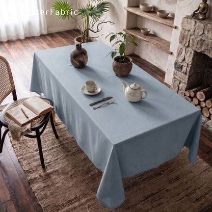 solid blue rectangle tablecloth draped over rectangle table