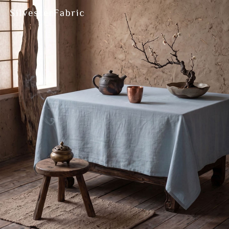 solid blue rectangle tablecloth laid flat on dining table