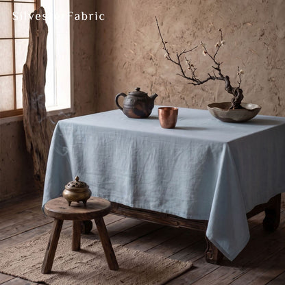 solid blue rectangle tablecloth laid flat on dining table