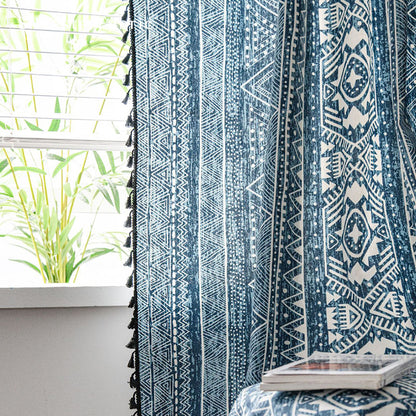 Bohemian blue printed curtains hanging in the window