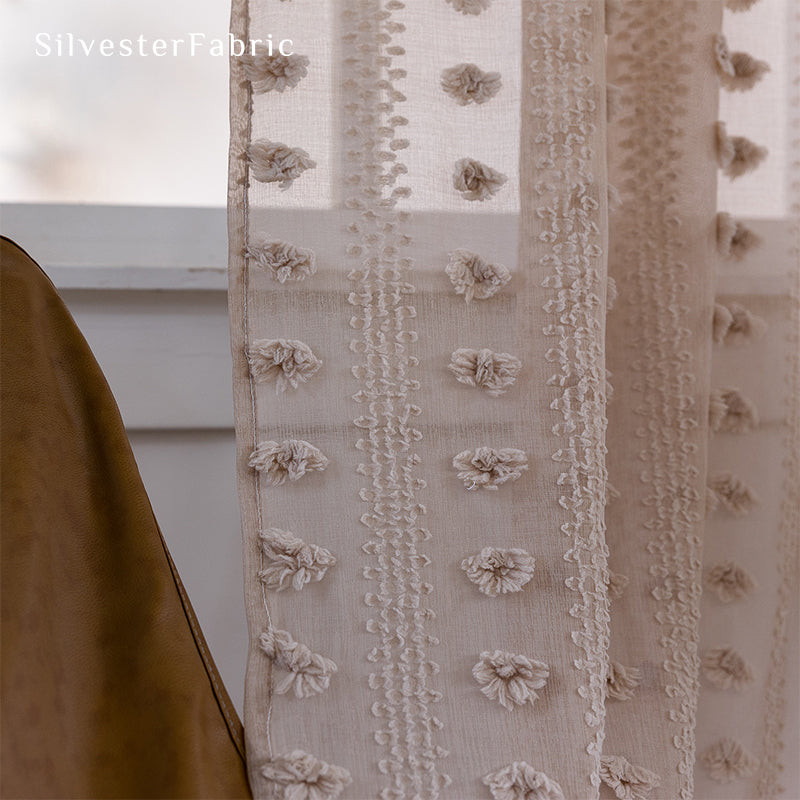 Brown sheer curtains hanging in the bedroom window