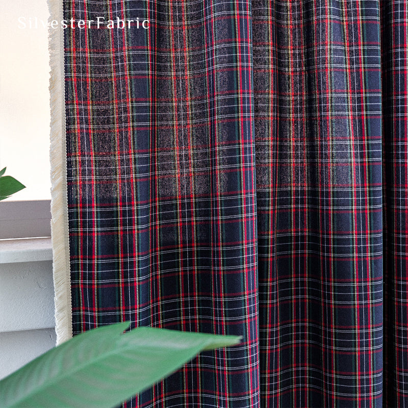 Christmas plaid blue curtains hanging in the living room window