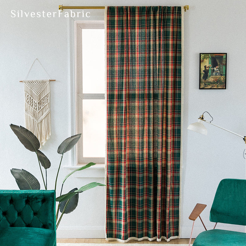 Green plaid Christmas curtains hanging in the living room window