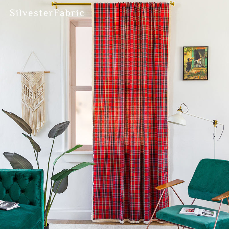 Red Christmas plaid curtains hanging in the living room window