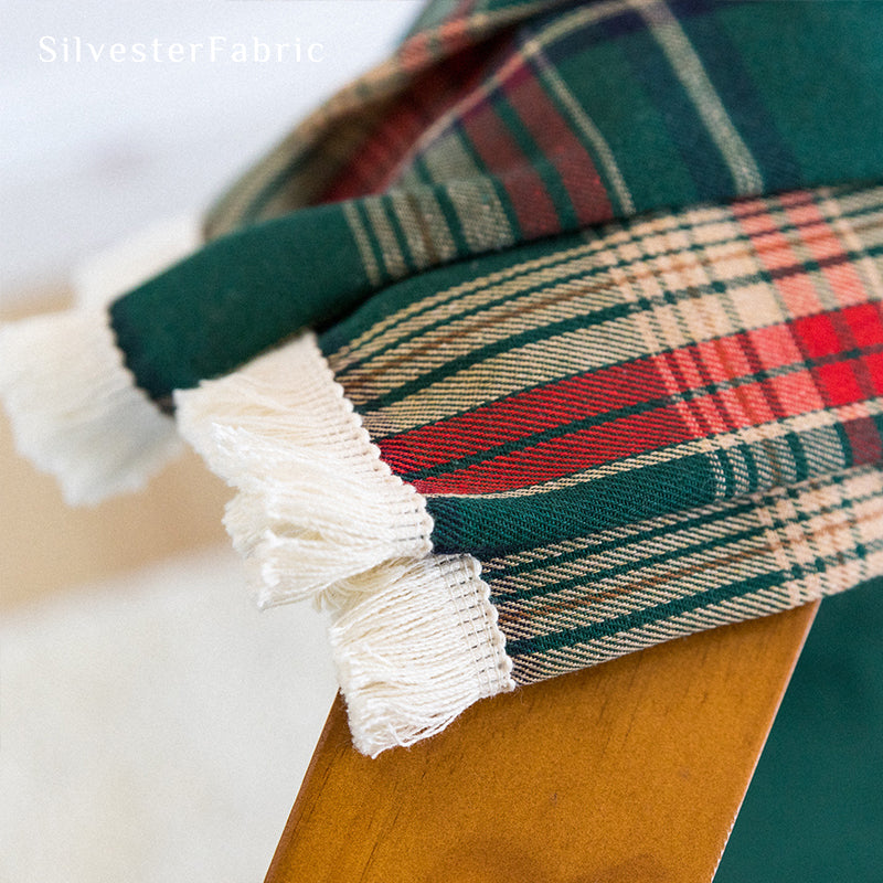 Green plaid Christmas curtains hanging in the living room window