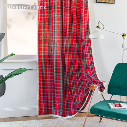 Red Christmas plaid curtains hanging in the living room window