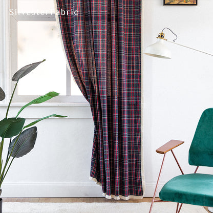 Christmas plaid blue curtains hanging in the living room window