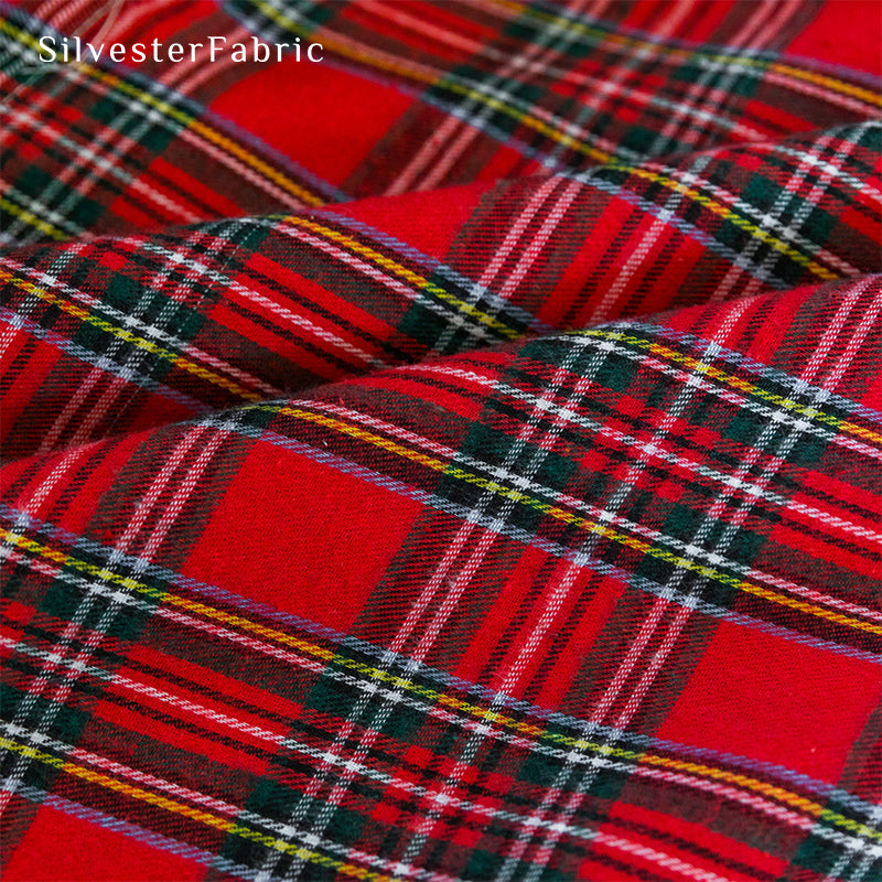 Red Christmas plaid curtains hanging in the living room window