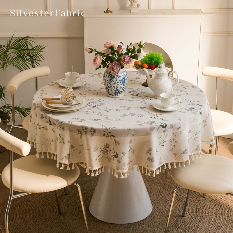 farmhouse floral round tablecloth laid flat on dining table