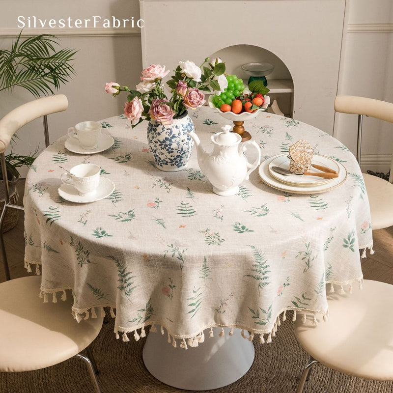floral farmhouse round tablecloth laid flat on dining table
