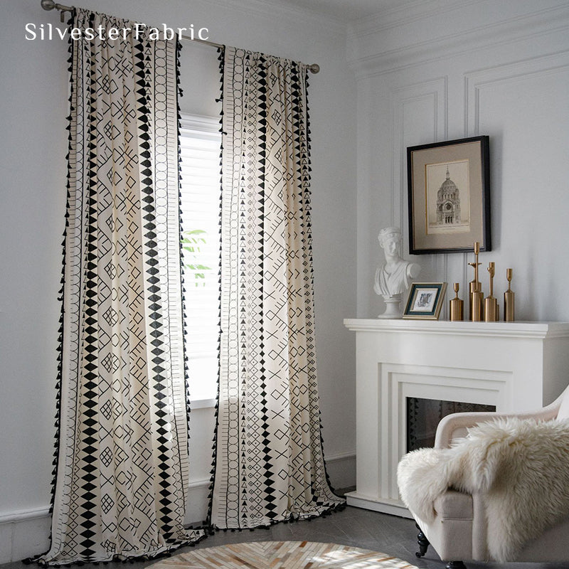 White geometric linen curtains hanging in the bedroom window