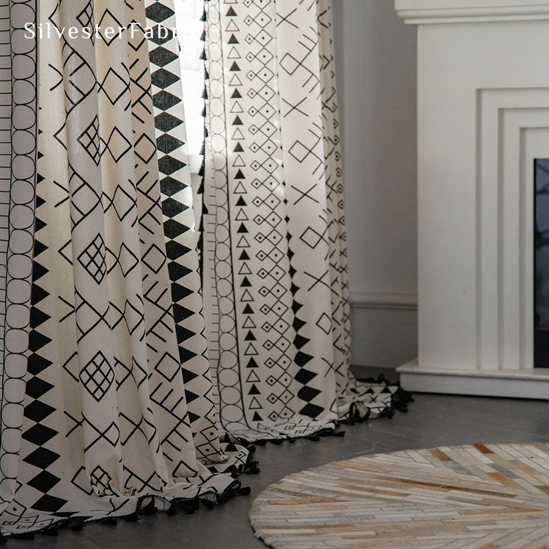 White geometric linen curtains hanging in the bedroom window