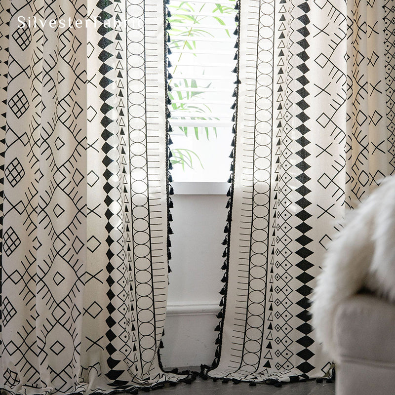 White geometric linen curtains hanging in the bedroom window