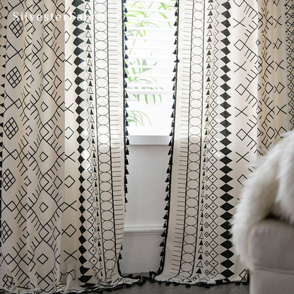 White geometric linen curtains hanging in the bedroom window