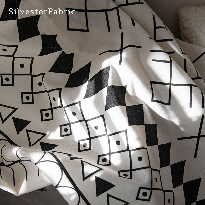 White geometric linen curtains hanging in the bedroom window