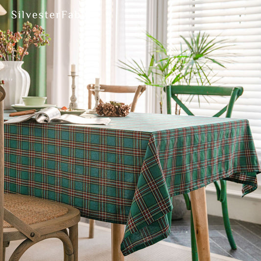 green Christmas tartan plaid cotton tablecloth laid flat on dining table