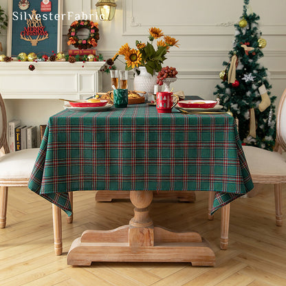 green Christmas tartan plaid cotton tablecloth draped over rectangle table