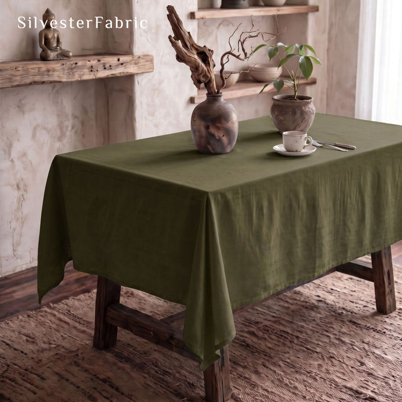 solid green rectangle tablecloth laid flat on dining table