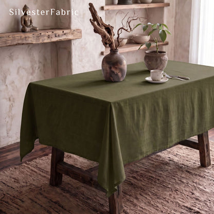 solid green rectangle tablecloth laid flat on dining table