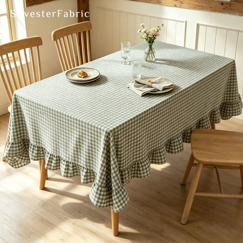 green plaid farmhouse tablecloth draped over rectangle table