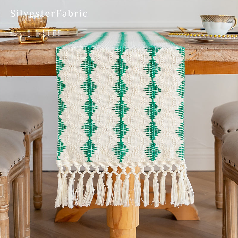 Green table runner in the centre of a wooden table