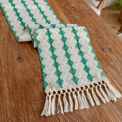 Green table runner in the centre of a wooden table