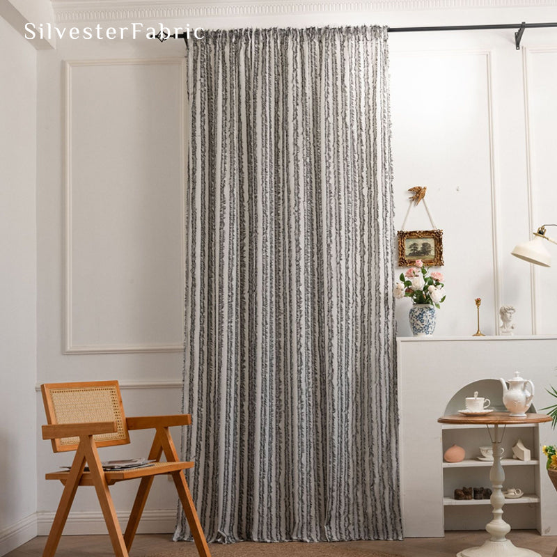 grey farmhouse striped curtain hanging in window