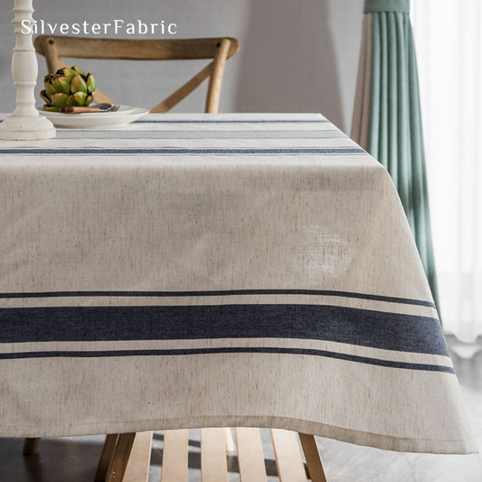 Gorgeous blue striped linen tablecloth over rectangular table