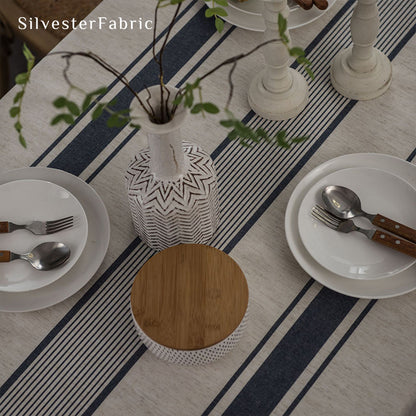 Gorgeous blue striped linen tablecloth over rectangular table