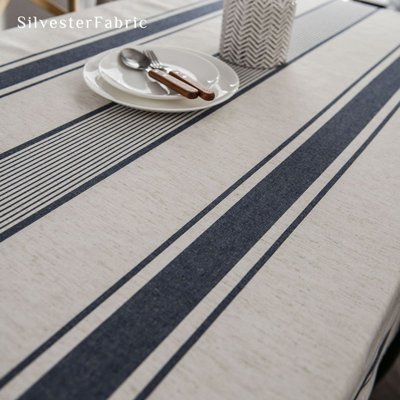 Gorgeous blue striped linen tablecloth over rectangular table