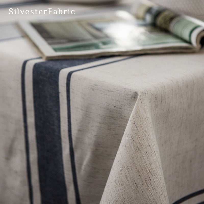 Gorgeous blue striped linen tablecloth over rectangular table