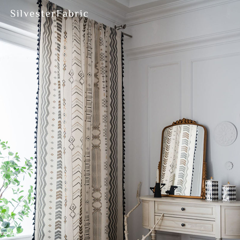 Bohemian geometric linen curtains hanging in bedroom window