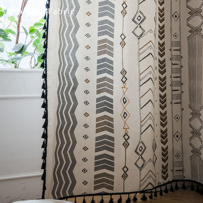 Bohemian geometric linen curtains hanging in bedroom window