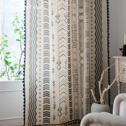 Bohemian geometric linen curtains hanging in bedroom window