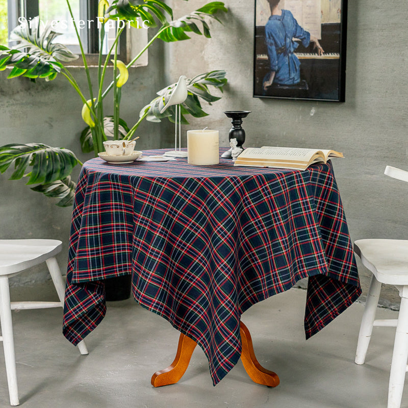 Navy Christmas tartan plaid cotton tablecloth laid flat on dining table