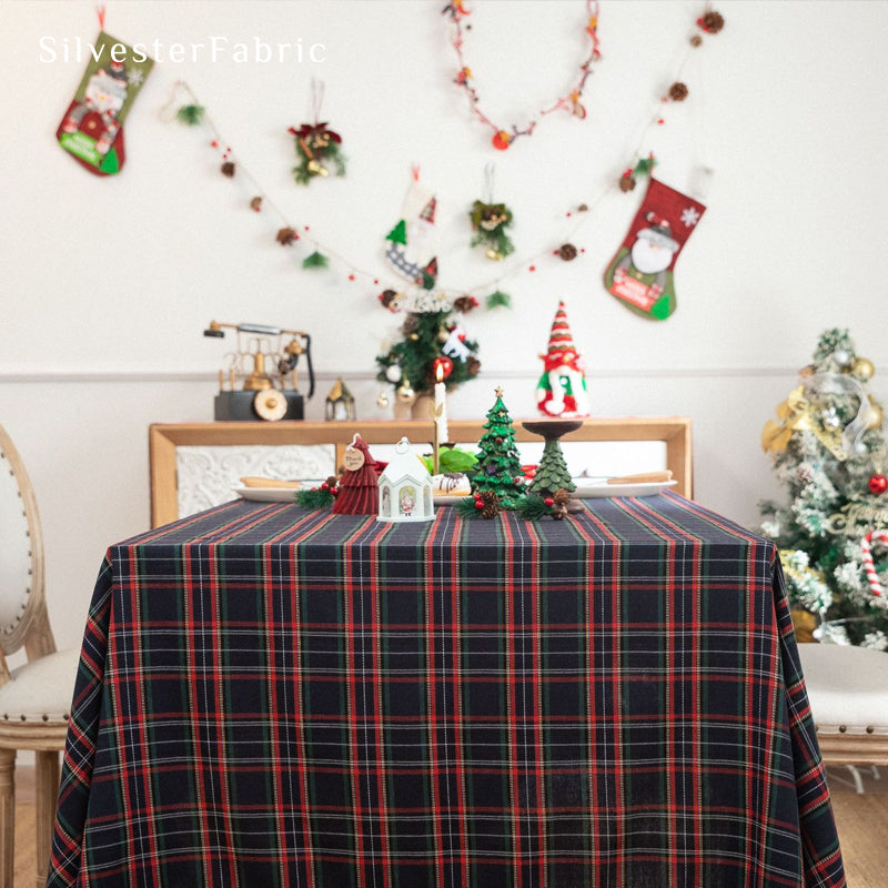 Navy Christmas tartan plaid cotton tablecloth draped over rectangle table