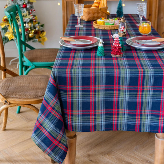 blue Christmas tartan plaid cotton tablecloth laid flat on dining table