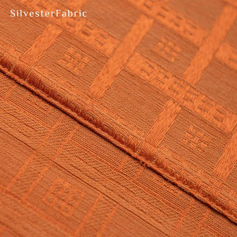 Orange jacquard farmhouse curtain fabric close-up