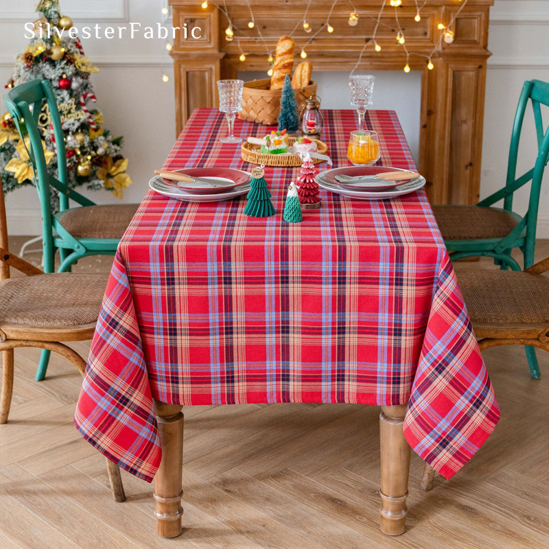red Christmas tartan plaid cotton tablecloth draped over rectangle table