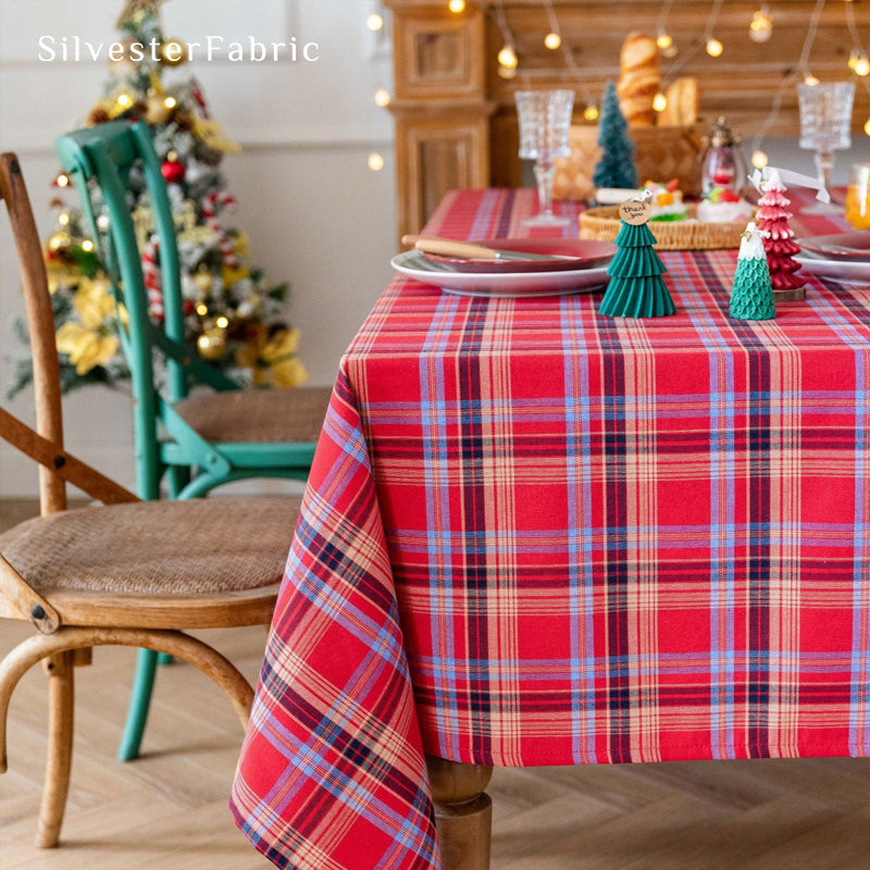 red Christmas tartan plaid cotton tablecloth laid flat on dining table